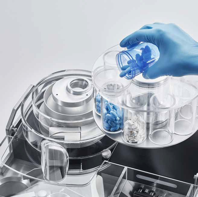 AT50 automatic tablet hardness tester with magazine feeder that can hold up to ten items.